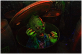 Photo of a zombie popping out of a toxic waste container